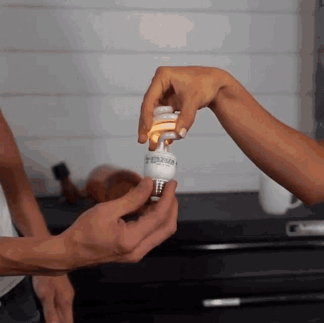 Powering Light With Hands The King Of Random GIF - Powering Light With Hands The King Of Random Physics Experiment GIFs