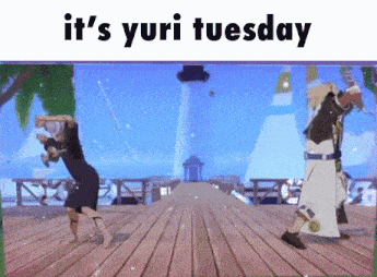 a couple of people are dancing on a stage with the words it 's yuri tuesday above them