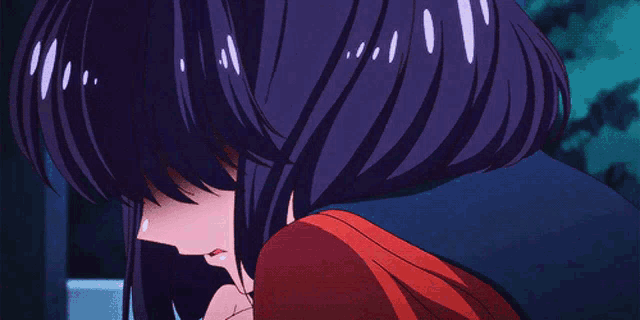 a girl with purple hair is hugging another girl in a red shirt