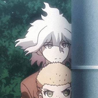 a couple of anime characters are standing next to each other .