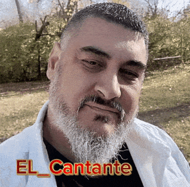 a man with a beard and the name el cantante on his chest