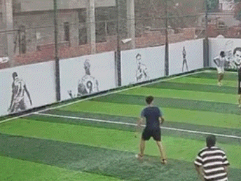 a group of young people are playing soccer on a soccer field .