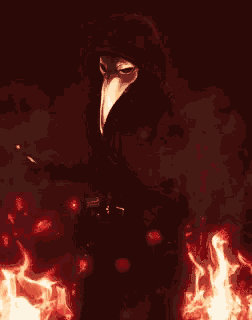 a man with a long beak mask stands in front of a fire