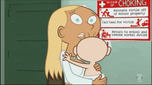 a woman is holding a child in front of a sign that says " in case of choking "