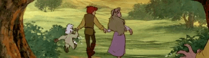 a man and a woman are walking through a forest holding hands