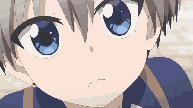 a close up of a person 's face with a blue eye