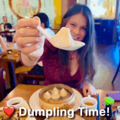 a woman is holding a spoon with a dumpling on it and the words dumpling time written below her