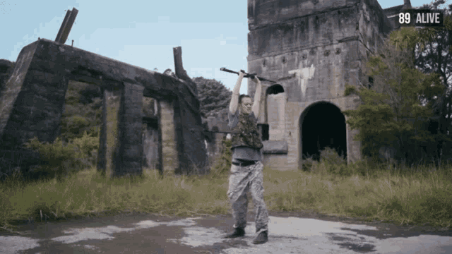 a man holding a sword in front of a building with the number 89 visible