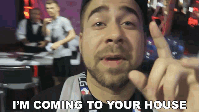 a man says i 'm coming to your house while giving a peace sign