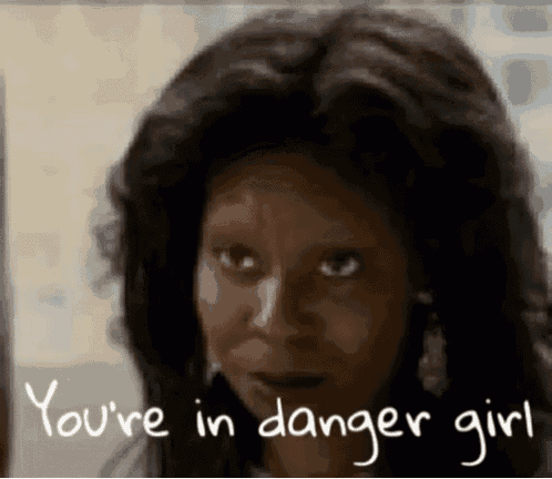 a close up of a woman 's face with the words you 're in danger girl written on the bottom