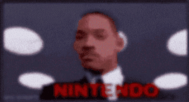 a blurry picture of a man with the word nintendo in red letters