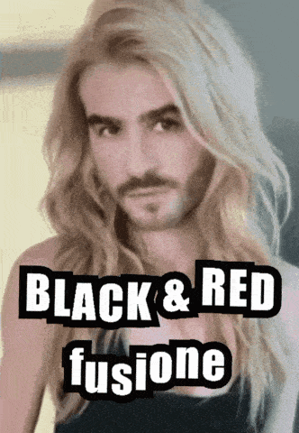 a man with long blonde hair and a beard has black and red fusione written on his face