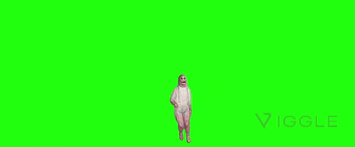 a man in a mummy costume is standing in front of a green screen .