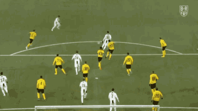a soccer game is being played on a field with the letters br on the bottom right