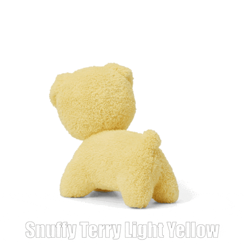 a teddy bear with the words snuffy terry light yellow underneath it