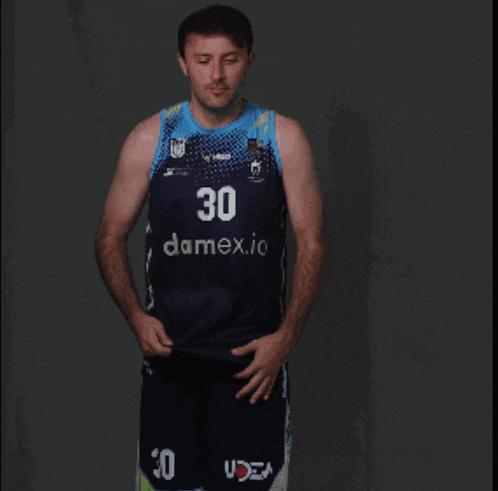 a man wearing a jersey with the number 30