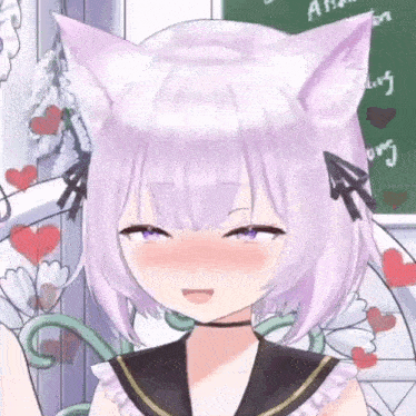 a close up of a girl with cat ears making a face .