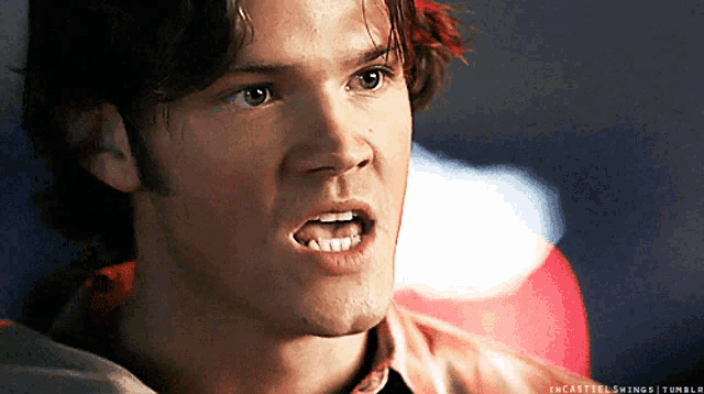 a close up of a man 's face with the words " encastelswings tumblr " written below it