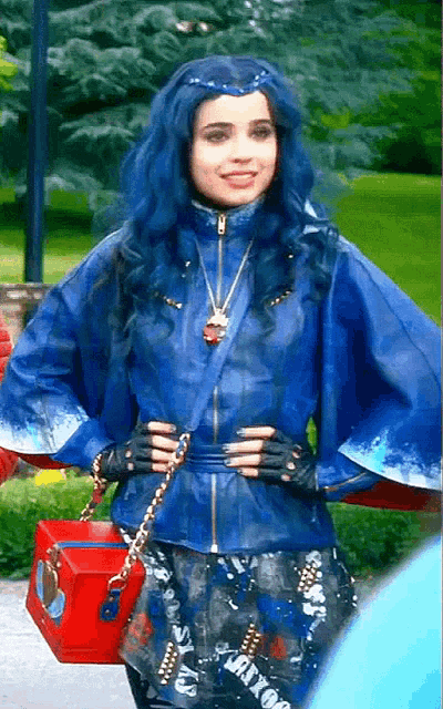 a woman with blue hair is wearing a blue jacket and holding a red box that says mixx
