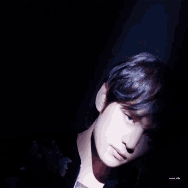 a close up of a young man 's face with the words missed jelly below him