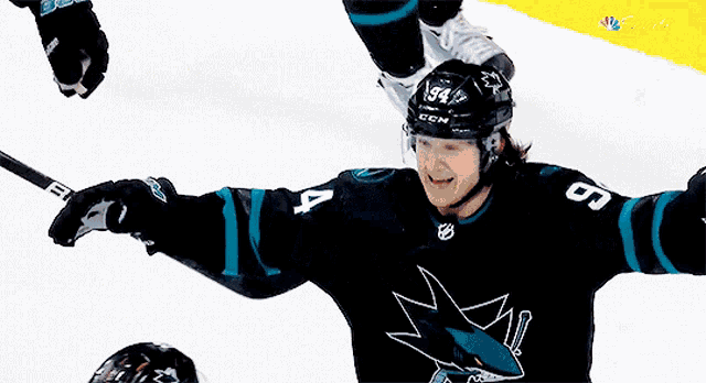a bauer hockey stick is being held by a player