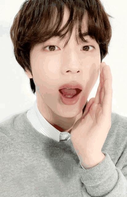 a close up of a person 's face with their tongue sticking out