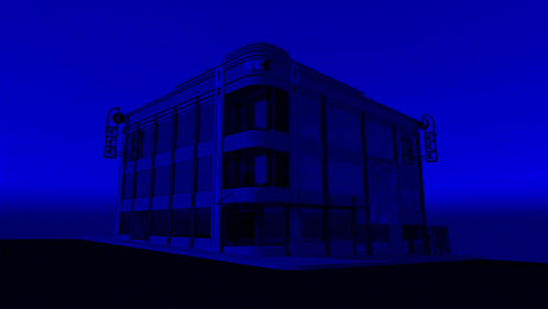 a building with a sign that says ' abc ' on it in blue