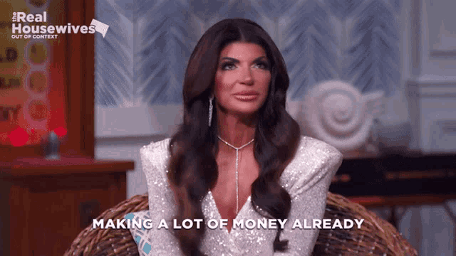 a woman is sitting in a chair with the words making a lot of money already
