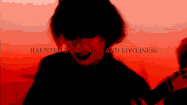 a red background with the words haunted by terror and lonliness