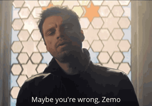 a man is standing in front of a stained glass window and says maybe you 're wrong zemo