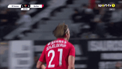 a soccer player with the number 27 on their shirt