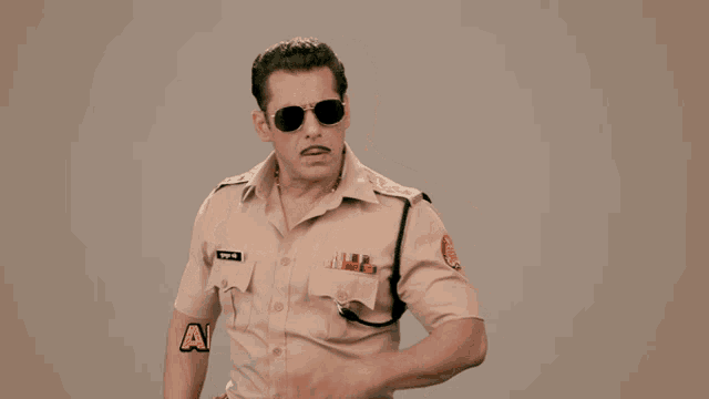 a man in a police uniform has the words arre aise kaise written above him