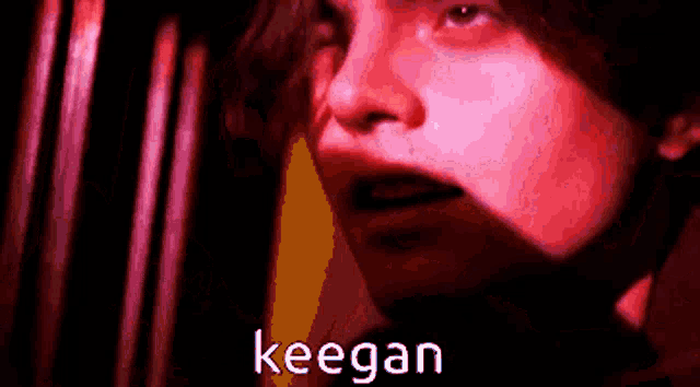 a close up of a person 's face with the word keegan in the corner