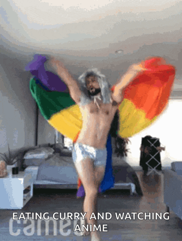 a shirtless man is dancing with a rainbow flag behind him and the words eating curry and watching anime on the bottom