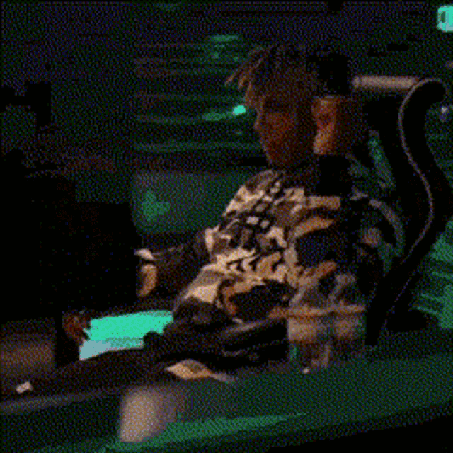 a man with dreadlocks is wearing a white sweatshirt with the word adidas on it .