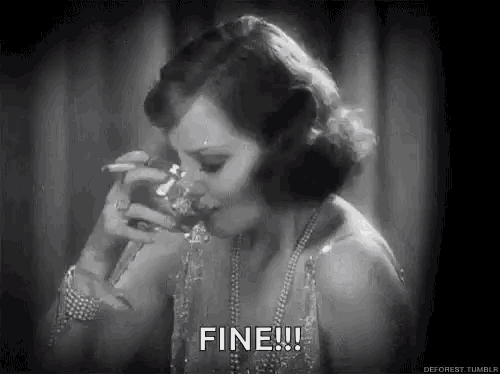 a woman is drinking from a glass and smoking a cigarette .