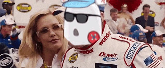 a woman is standing next to a race car driver wearing sunglasses and a shirt that says dennit