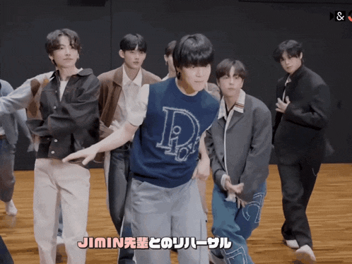 a group of young men are dancing with jimin written in a foreign language