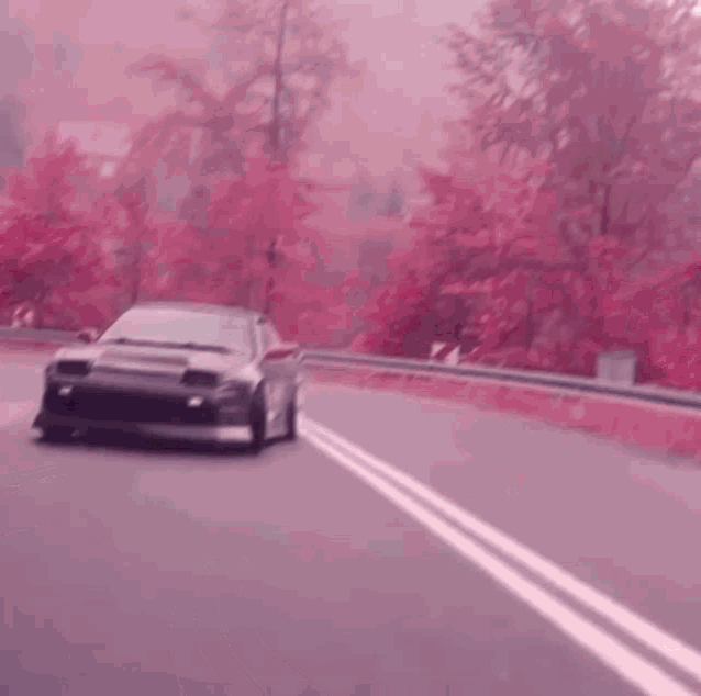 a car is driving down a road with the word ro written on it