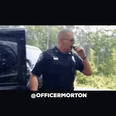 Officer Morton Badge GIF - Officer Morton Badge Cool Cop GIFs