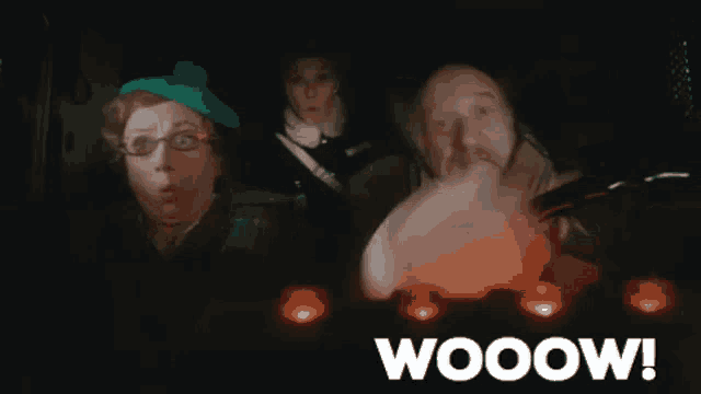 a group of people in a car with the word wooow written in white