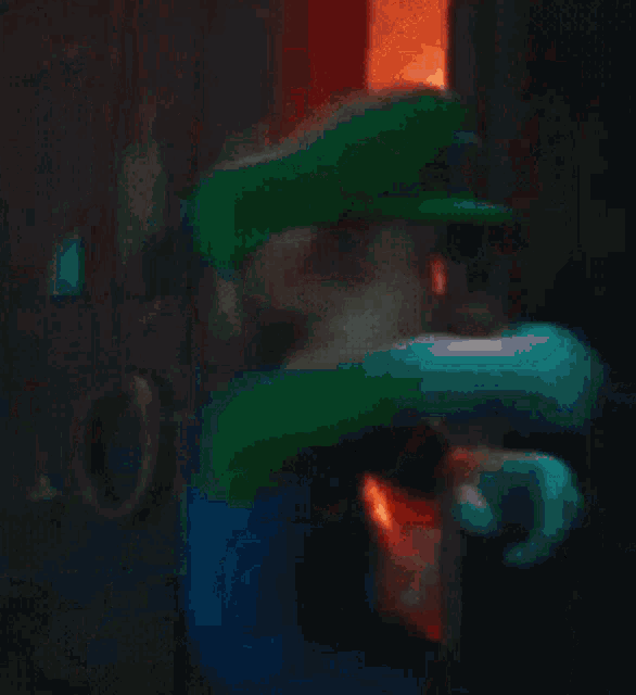 a blurred image of a man in a green hat