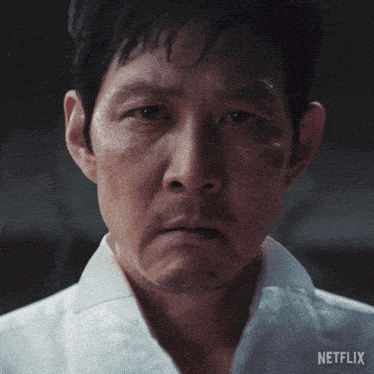 a close up of a man 's face with netflix written on the bottom right