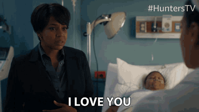 a woman says i love you while standing next to a hospital bed
