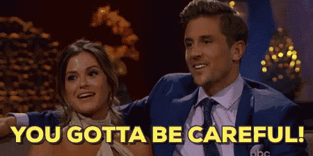 a man and a woman are sitting next to each other and the man is saying `` you gotta be careful ''