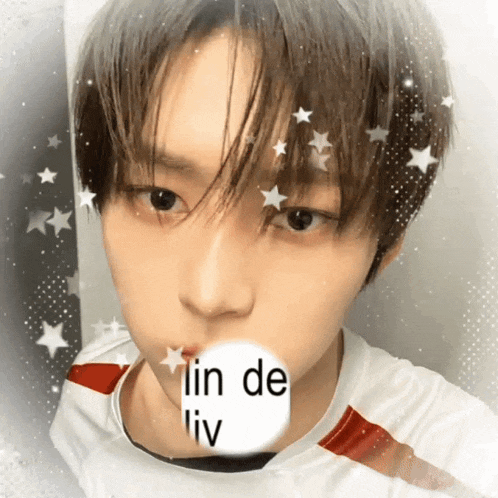 a young man with a white circle in his mouth that says lin de liv