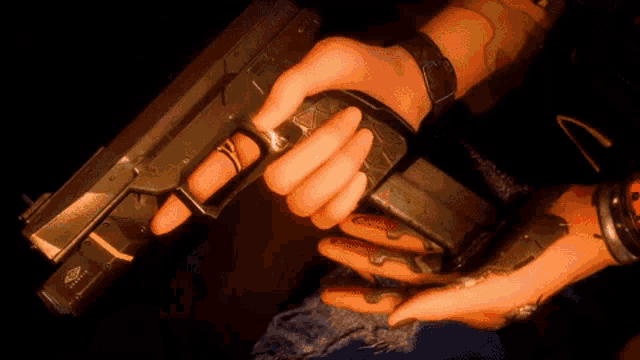 a close up of a person holding a gun that says ' glock ' on the bottom