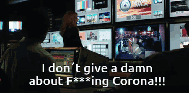 a screen shows a news crew and says i don t give a damn about f *** ing corona
