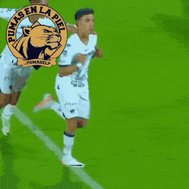 a pumas en la piel logo is displayed above a soccer game