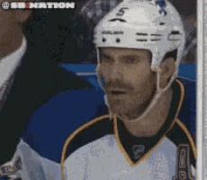 a hockey player wearing a helmet that says 5 on it